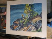 Photo showing the full framed abstract watercolor landscape print with tree and rocks.