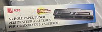 Box of the ACCO 2-3 hole paper punch showing product model, branding, and hole puncher image.