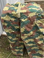 Full view of military pants showing camouflage colors and style.