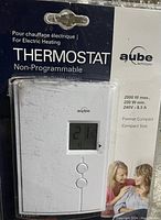 Photo of the new in package Aube non-programmable thermostat for electric heating