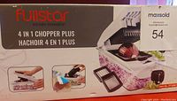 Photo of original box showing Fullstar 4 in 1 Chopper Plus product with illustrations of functions and branding.