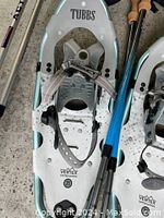 Close-up of a Tubbs Vertex Edition snowshoe showing adjustable binding straps and crampons underneath.