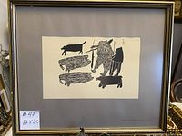 Framed vintage Inuit print with gray matting and gold-tone frame showing the entire artwork and frame.