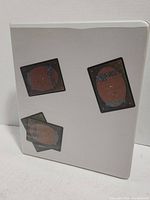 Front view of white binder with Magic The Gathering card back design printed on front cover.