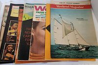 Lot of 6 vintage magazines with varied colorful covers laid out stacked and fanned showing front covers.