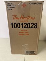 Box labeled Tim Hortons 1000 medium paper hot drink cups with product code and branding.