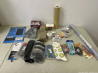 Full overview of all miscellaneous new items including stationery, socks, and assorted stickers on a table.