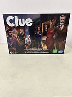 Front of sealed Clue board game box showing six suspect characters and game title.