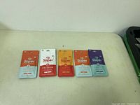 Five sealed patch packages in different colors and labeled Victory, Freedom, Ignite, Liberty on a white surface.