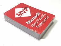 Photo of sealed Microsoft MVP branded playing card deck in original shrink wrap, showing front of box with red and white design.