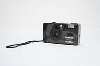 Front view of ILFORD Harman Reusable 35mm camera showing lens, flash, and wrist strap.