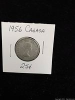 Front side of the 1956 Canadian 25 cent silver coin showing Queen Elizabeth II.
