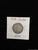 Obverse side of the coin showing Queen Elizabeth II profile and inscriptions.