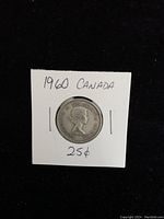 Obverse side of the 1960 Canadian quarter showing Queen Elizabeth II portrait and inscriptions.