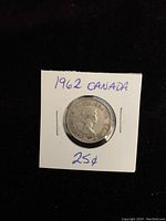 Obverse side of 1962 Canadian silver quarter showing Queen Elizabeth II profile in coin holder labeled '1962 CANADA 25¢'
