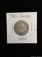 Obverse side of the 1963 Canadian quarter showing Queen Elizabeth II profile and coin details.