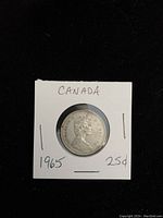Front side of the 1965 Canadian silver quarter showing Queen Elizabeth II's portrait and inscriptions.
