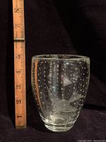 Clear glass vase with evenly distributed controlled bubbles and etched fish motif shown with ruler measuring approximately 6 inches tall.