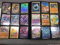 Open binder page showing 18 Pokémon cards including holofoil and V/VMAX cards