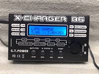 Front view of charger showing LCD screen active and branding on case