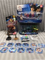 Photo showing the lot with Disney Infinity Marvel Hulkbuster figure, Aladdin and Jasmine set, power discs, and loose figures.