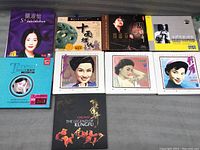 Overview of 11 international music CDs, mostly Asian artists, with diverse album cover art including photographs and graphic art.