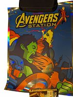 Foil Marvel Avengers poster featuring Hulk, Iron Man, and Captain America with a vibrant comic style design and reflective border.