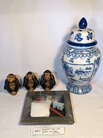 Full set of the blue and white Asian themed vase with lid, three decorative monkey figurines, and mini zen garden tray with accessories.
