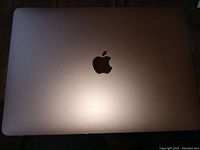 Closed top view showing Rose Gold aluminum lid with Apple logo