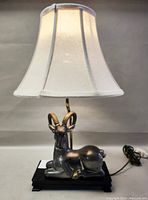 Front view of lamp with shade attached showing overall design and condition.
