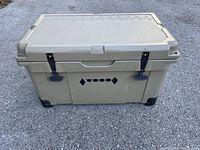 Front exterior view showing WOODS logo, latches and lid