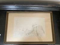Framed pencil drawing showing the full artwork with visible mat and black wooden frame.