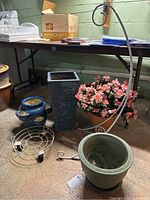 Wide shot showing all items in the lot including pots, plant stand, and hook stand.