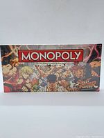 Front view of the sealed Monopoly Street Fighter Collector's Edition game box showing colorful character artwork and Monopoly logo.