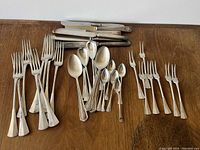 Overhead view of all flatware arranged on tabletop