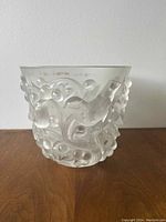 Front view of frosted glass bowl with hummingbird and grapevine relief motif