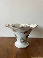 Porcelain vase with flared scalloped rim, butterfly and floral motif, gold trim