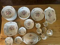 Overall layout of all plates, bowls, cups and serving pieces on table