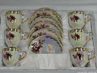 Full set of six porcelain tea cups and six matching saucers in original box with cushioned lining