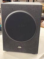 Front view of the Hsu Research VTF-3 HP subwoofer showing the black fabric grille and textured black enclosure.