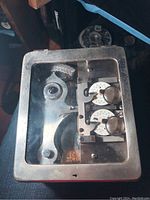 Top view of gauge box closed showing glass-covered lid and metal frame