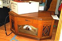 Emerson vintage style wooden record player showing top and front with wood cabinets, speaker grills, and control panel