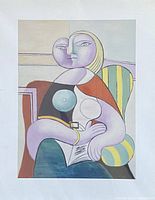 Full view of unframed Picasso lithograph Woman Reading laid flat with visible colors and artwork details.