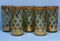 Set of six vintage Culver Valencia highball glasses with ornate gold geometric and floral overlay detailing, showing front view.
