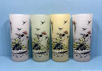 All four frosted glasses with Southern Belle design showing woman with umbrella, birds, and flowers from front side.