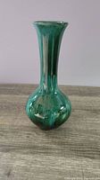 Front view of green glazed Blue Mountain Pottery vase showing shape and finish