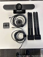 Overview of one MeetUp set showing camera, remote, cables and mount legs