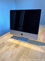 Front view of the Apple iMac showing the display, bezel, and stand