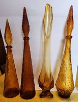 Frontal view of all five pieces side by side against white background