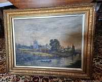 Front view of the entire framed painting showing castle and landscape scene.